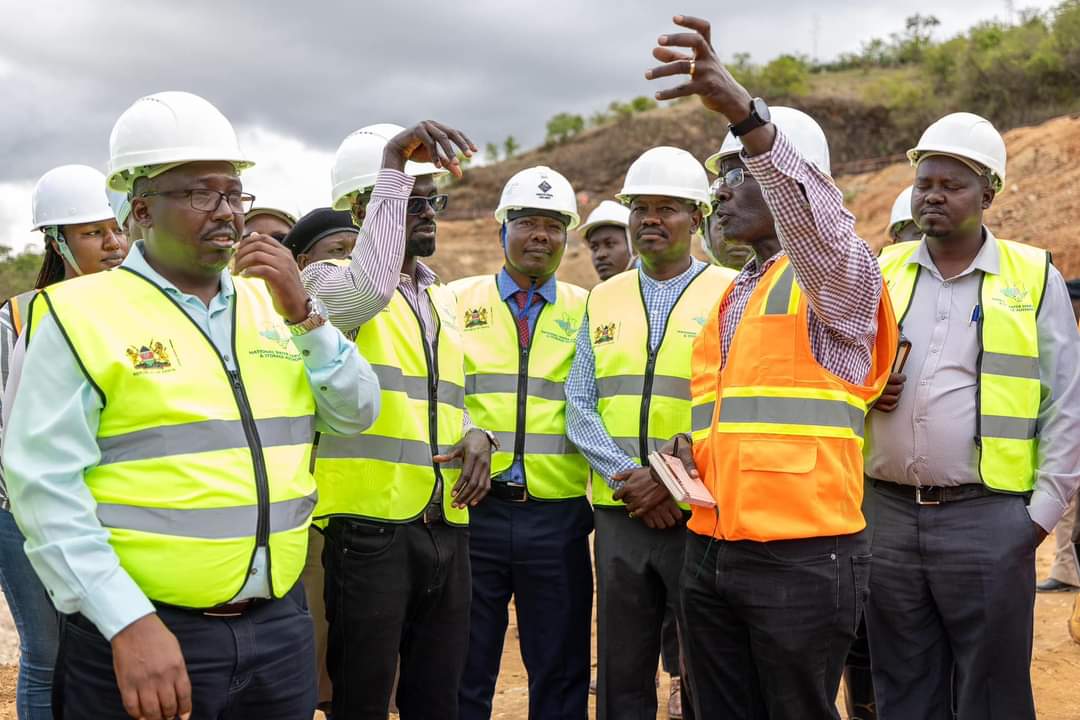 Water and Irrigation Cabinet Secretary Eng Eric Mugaa (second left) and other stake holders during a tour of Umaa Dam in Kitui County.