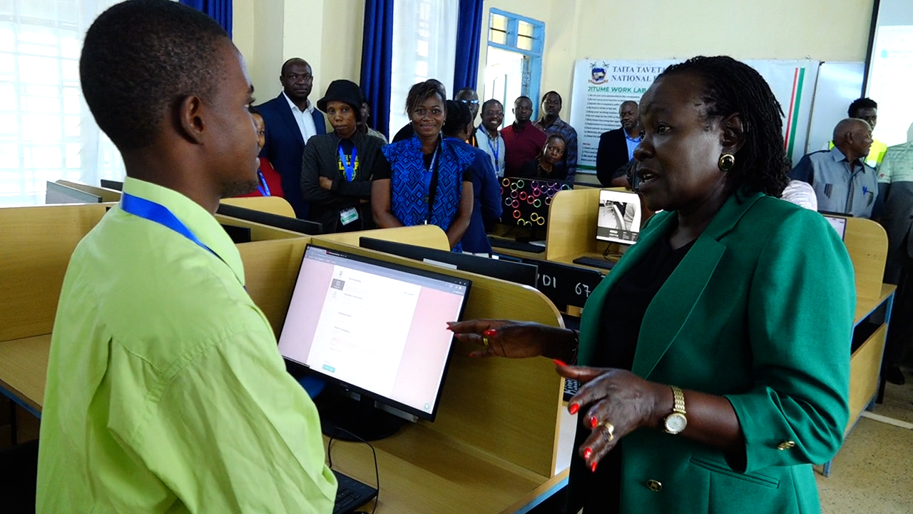 Technical and Vocational Education and Training (TVET) PS Dr. Esther Muoria, speaks to a student at the just commissioned gemology lab at Taita Taveta National Polytechnic at Voi