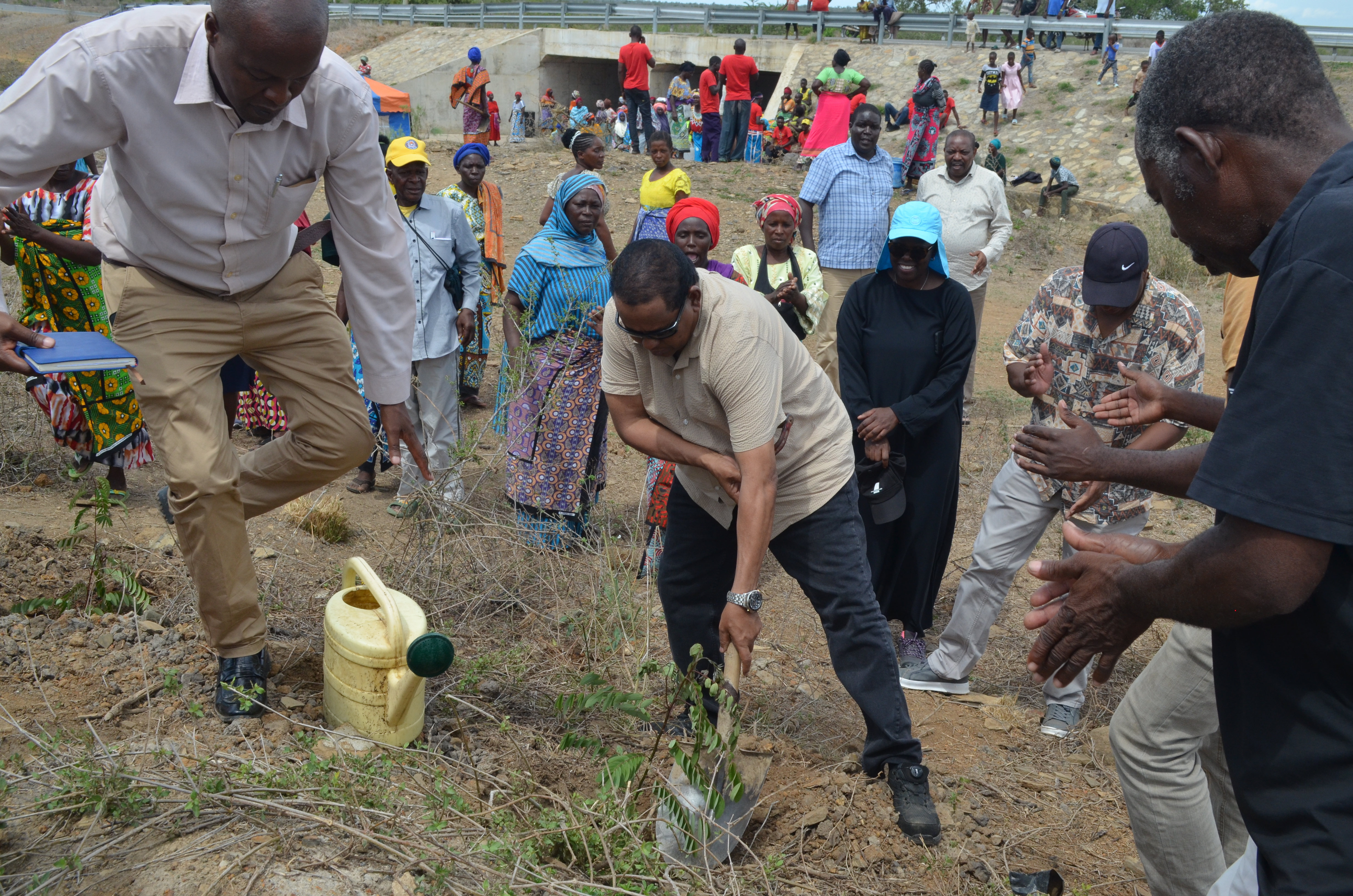Water Resources Authority CEO Mohamed Shurie (centre) planting a tree during an inspection tour of Mwache Dam.