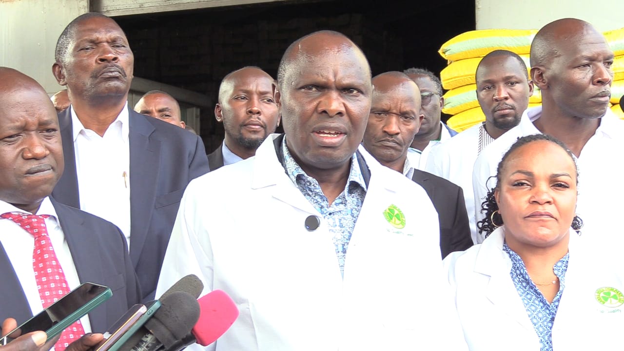 Head of Public Service and Chief of Staff Felix Koskei addressing the press in Kitale after visiting Kenya Seed Company stores. He was accompanied by Kenya Seed Company Board Chairperson Purity Ngirici (right)