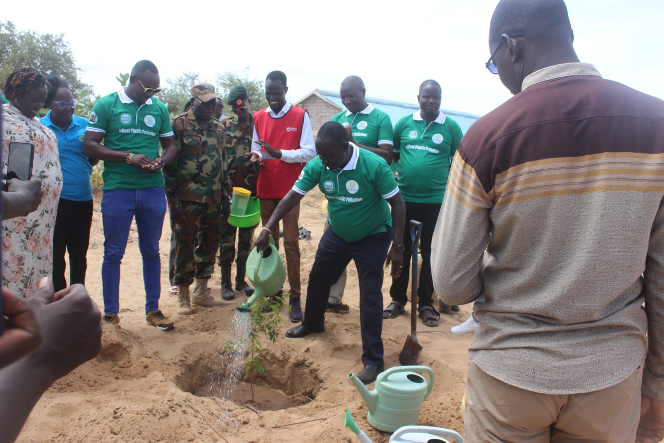Turkana residents plant trees during the world  environment day at Muli Christian Primary School in  Lokaparaparae village, Turkana Central. 