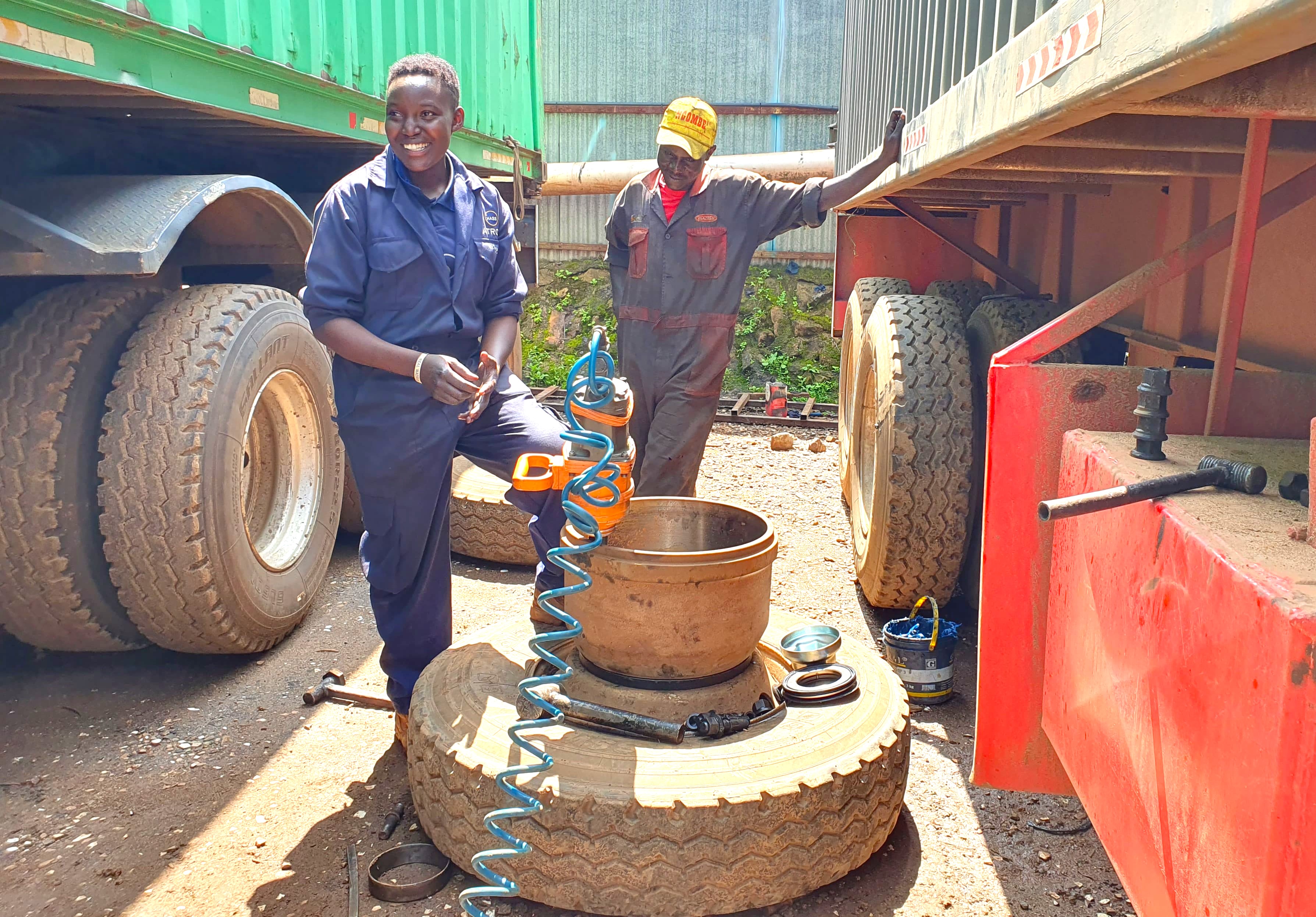 Miriam Chepchumba takes a rest after successfully fixing a faulty truck tyre in her garage. PHOTO/JOYCE JEPKOSGEI