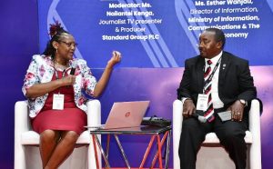 Ms. Esther Wanjau, Director of Information (ICT) at the Directorate of Information (L) , engages with James Mureu, the Chairman of the Micro and Small Enterprises Authority (R), on the implementation of Artificial Intelligence (AI) in business transactions in Kenya.