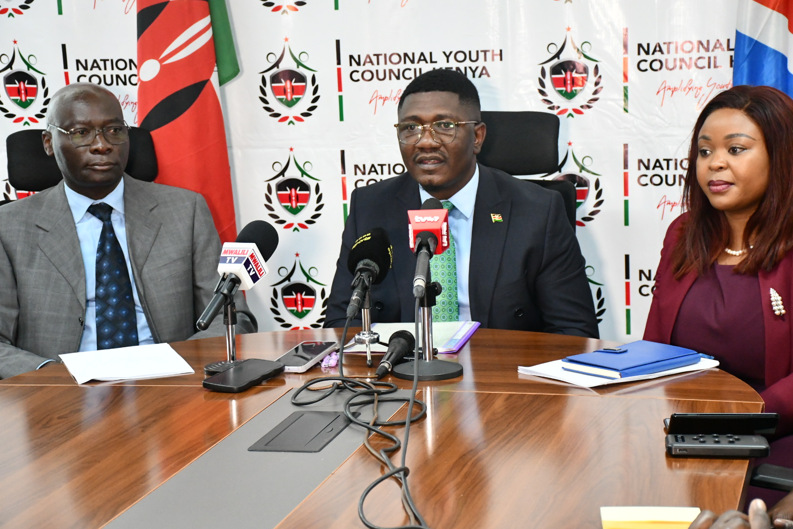 Principal Secretary, State Department for Youth Affairs and Creative Economy, Fikirini Jacobs (centre), Chief Executive Officer, National Youth Council, Ms Gloria Wawira (right) and National Steering Committee for the National Youth Council Elections, George Marcel Osaso, during the press briefing on upcoming National Youth Elections at Talanta Plaza, Nairobi.