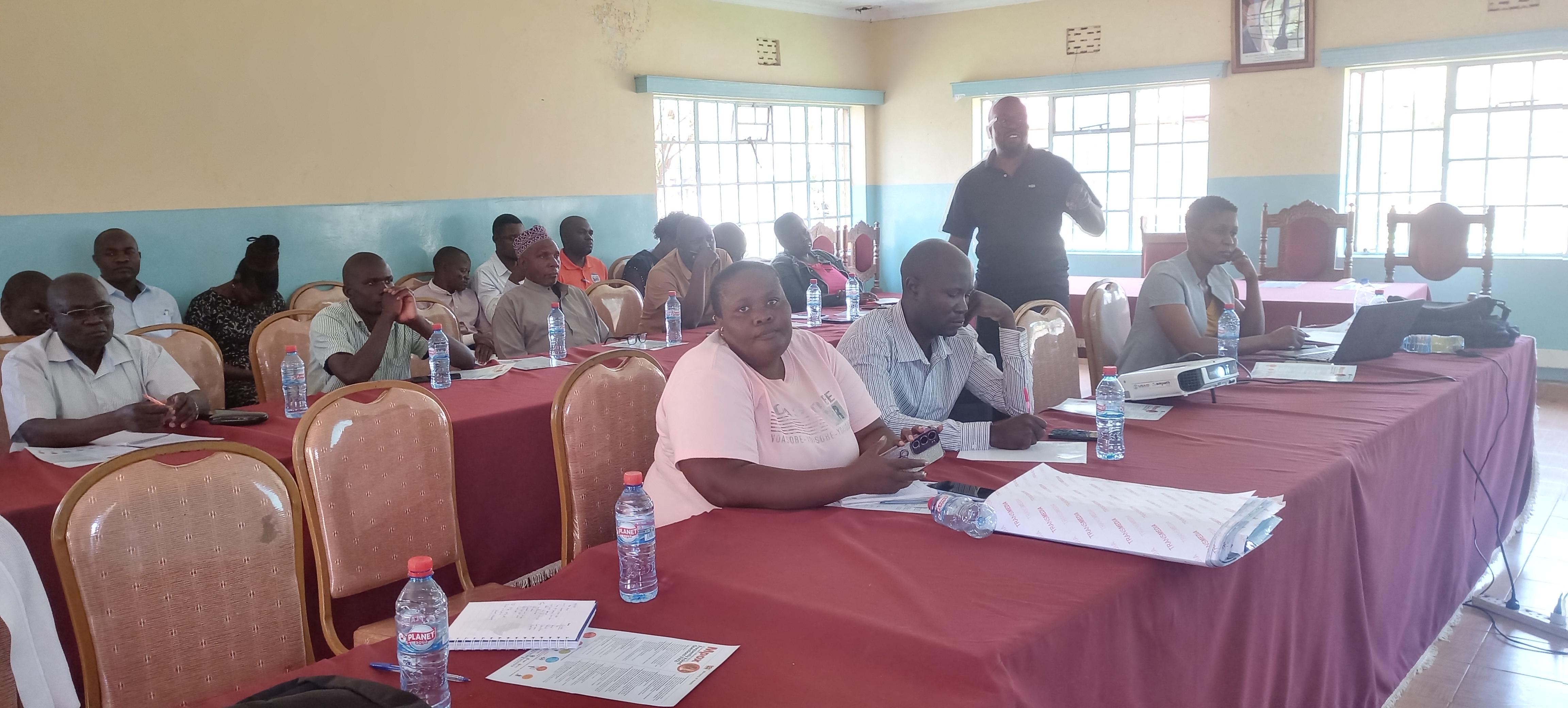 Busia Sub County Health Promotion Officer Kennedy Oloo address stakeholders during the Mpox Sensitization exercise at the County Commissioner’s Conference Hall 