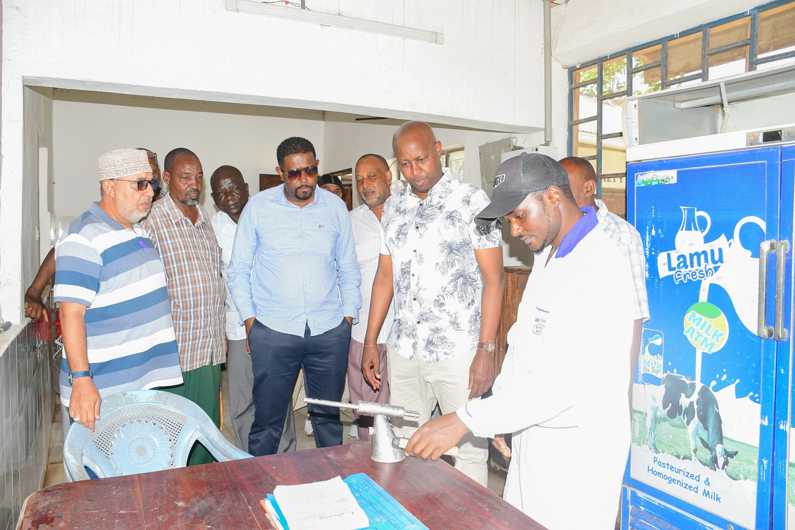 Principal Secretary for Investment Promotion Abubakar Hassan Abubakar (fourth from left, front row) together with his Cooperative counterpart PS Patrick Kilemi standing to his left joined officials of the Witu Livestock Cooperative Society for a group photo