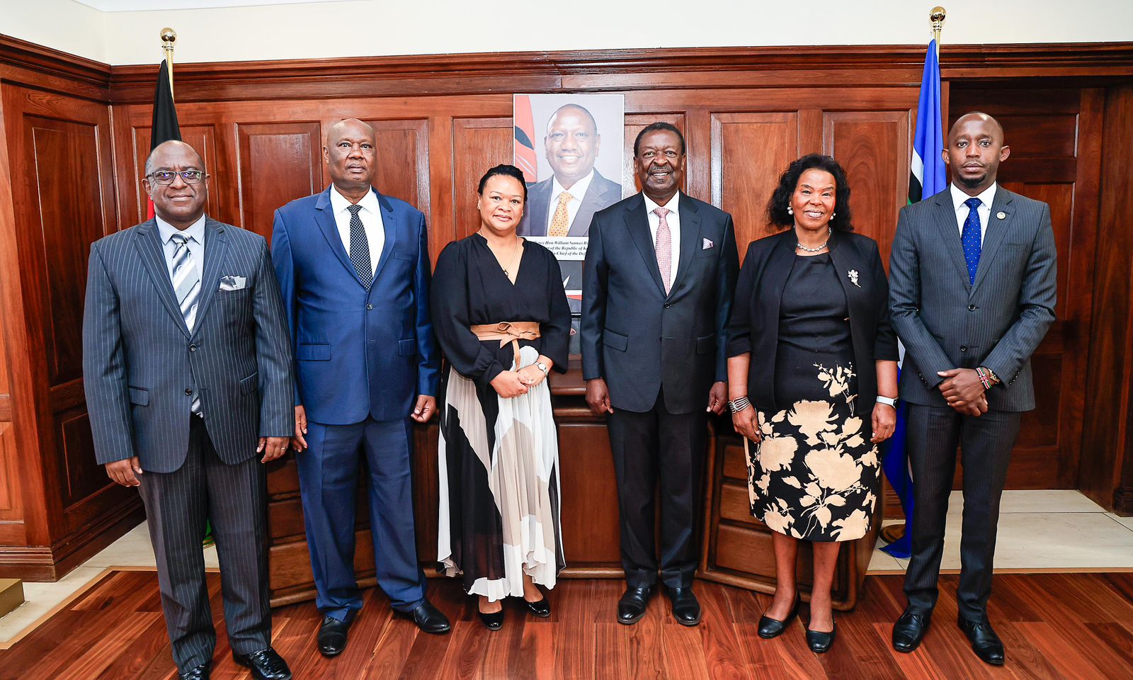 Prime Cabinet Secretary Musalia Mudavadi (third from right) with APRM CEO Amb. Marie-Antoinette Rose Quatre (third from left) during a courtesy call in Nairobi. Photo courtesy.