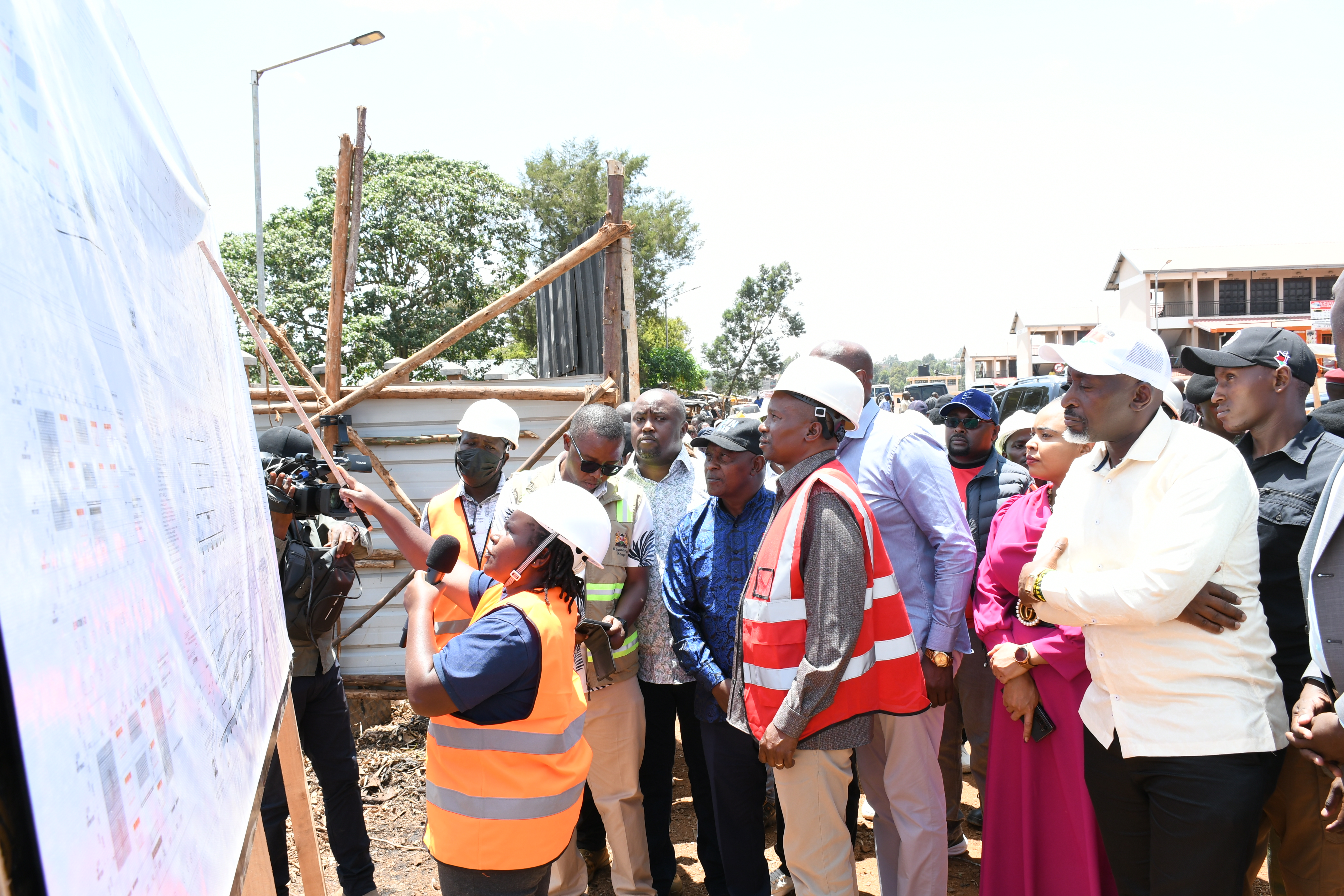 Deputy President Prof Kithure Kindiki (in a reflector jacket) views the architectural design of the Sh350 million Field Marshal Muthoni Kirima Modern Municipal Market in Nyeri.