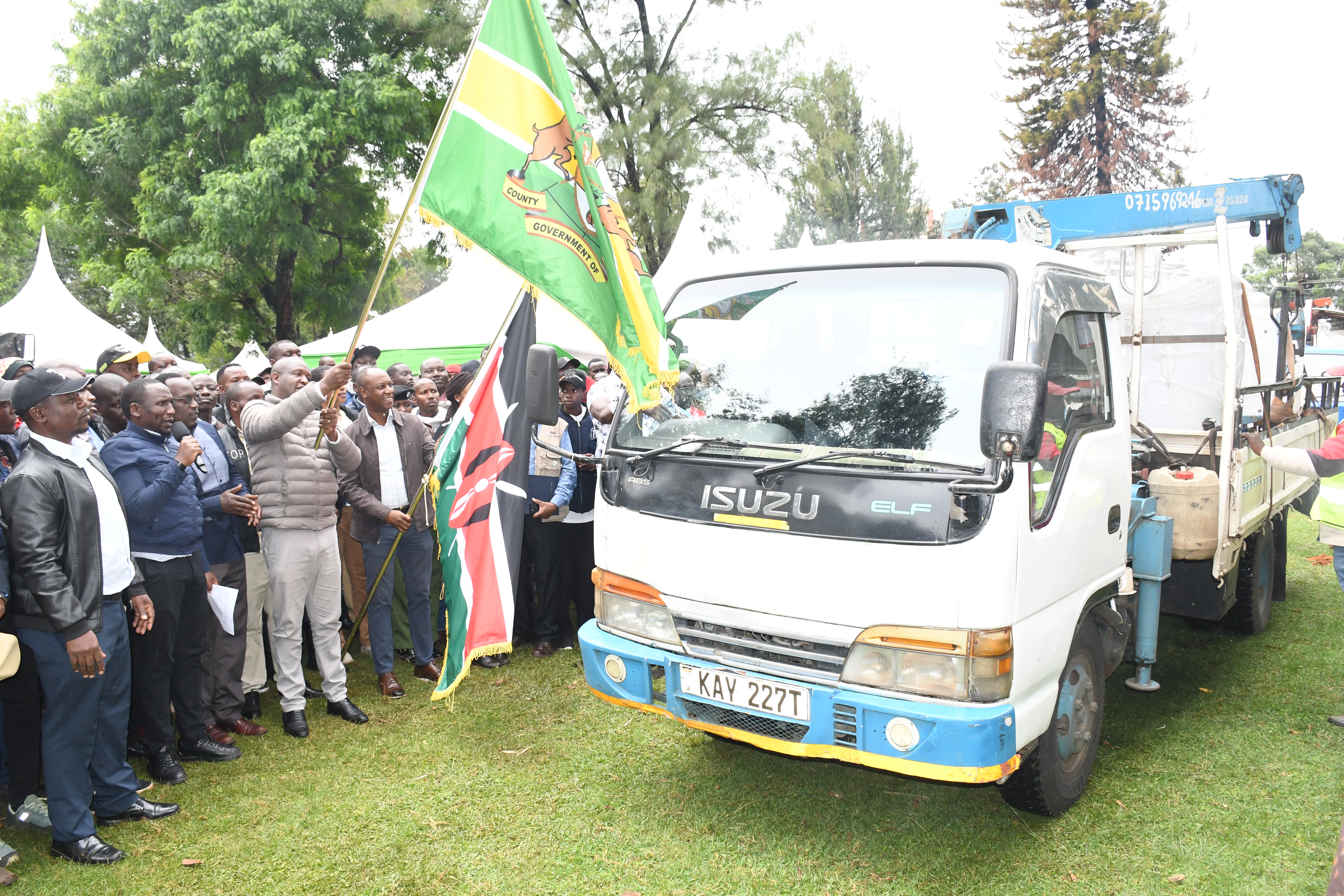 Principal Secretary for Livestock Development Jonathan Mueke flags off 12 government-supplied milk coolers at Moi Gardens in Kericho Town, he was joined by Kericho County Governor Dr. Eric Mutai, Senator Aaron Cheruiyot, Cooperative Union Chairman Moses Rotich, and other county and national leaders. PHOTO: KIBE MBURU