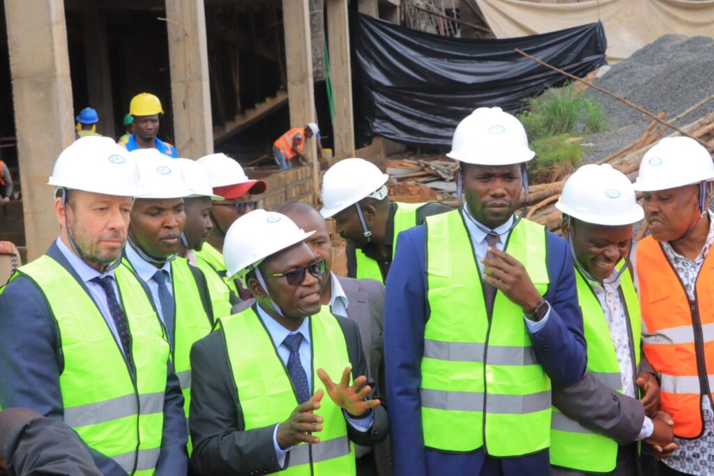 Broadcasting and Telecommunications Principal Secretary Stephen Isaboke (second left) and his Medical Services counterpart Dr. Ouma Oluga (centre) addressing the press after supervising the ongoing construction of the Kisii Cancer Centre.