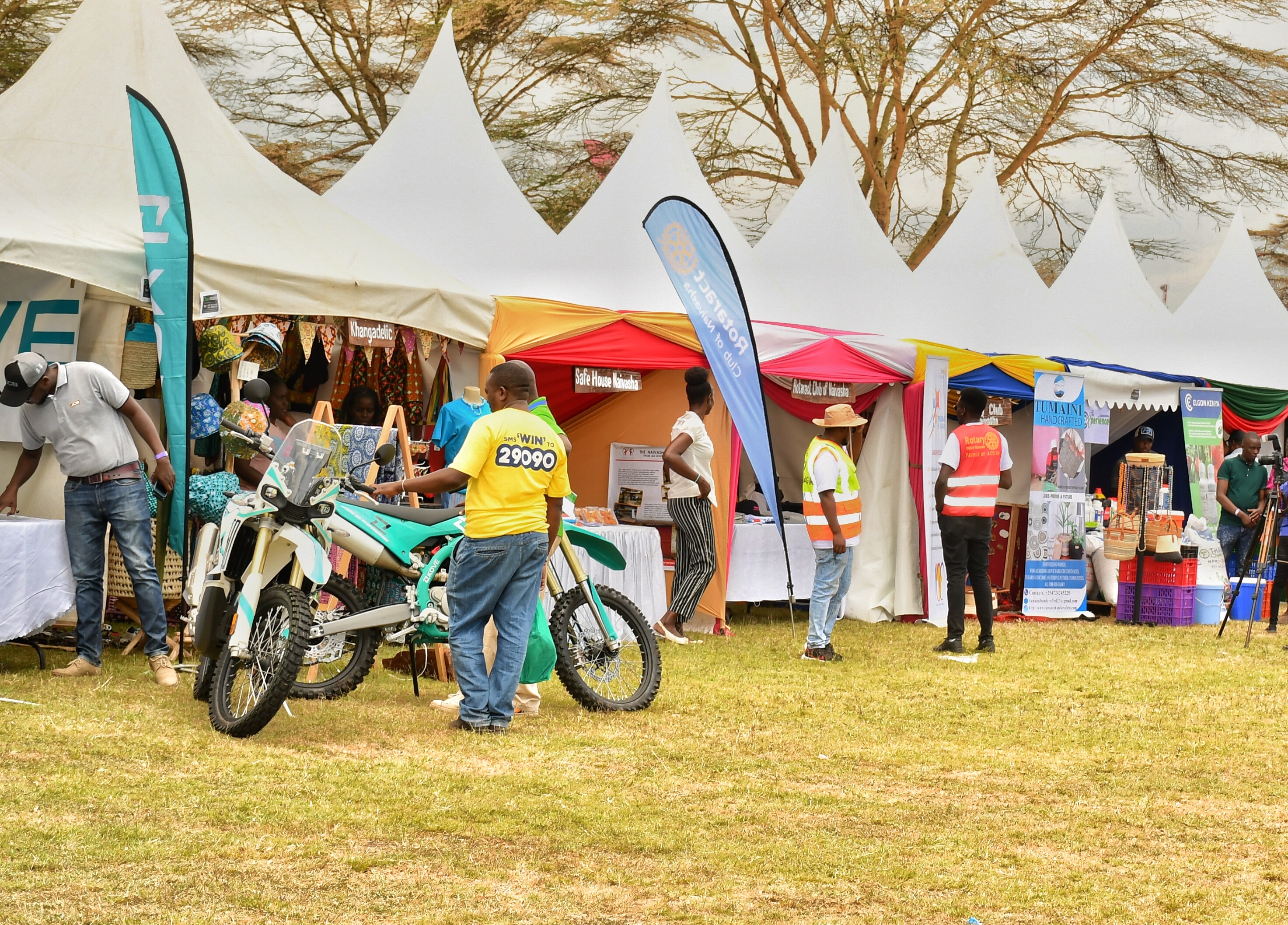 Farmers drawn from across the country tour a flower themed exhibition stand at the two day Naivasha Horticultural Fair 