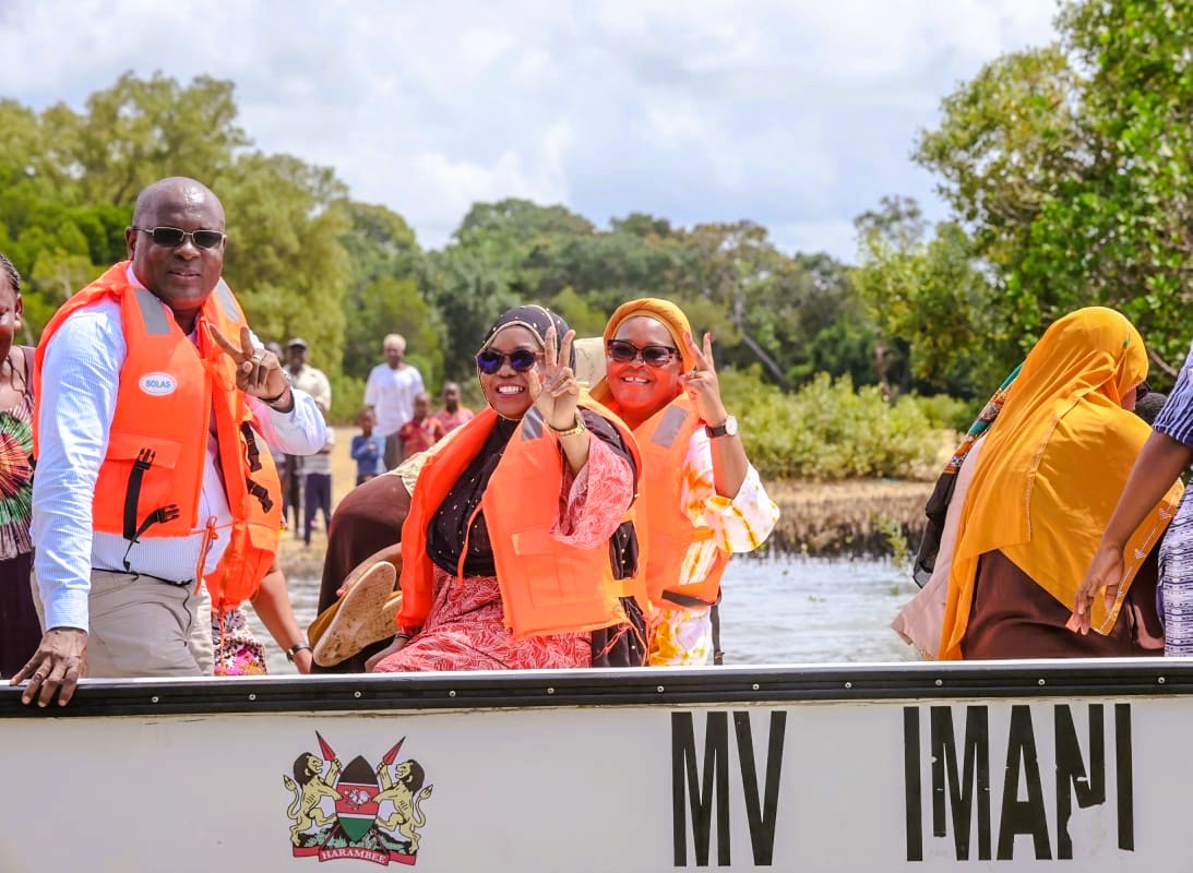 .From left Kwale County Executive Committee Member for Agriculture Roman Shera, Governor Fatuma Achani and County Executive for Environment Saumu Beja on board one of the four fiberglass boats that were issued to local fisherfolks in Msambweni sub county.