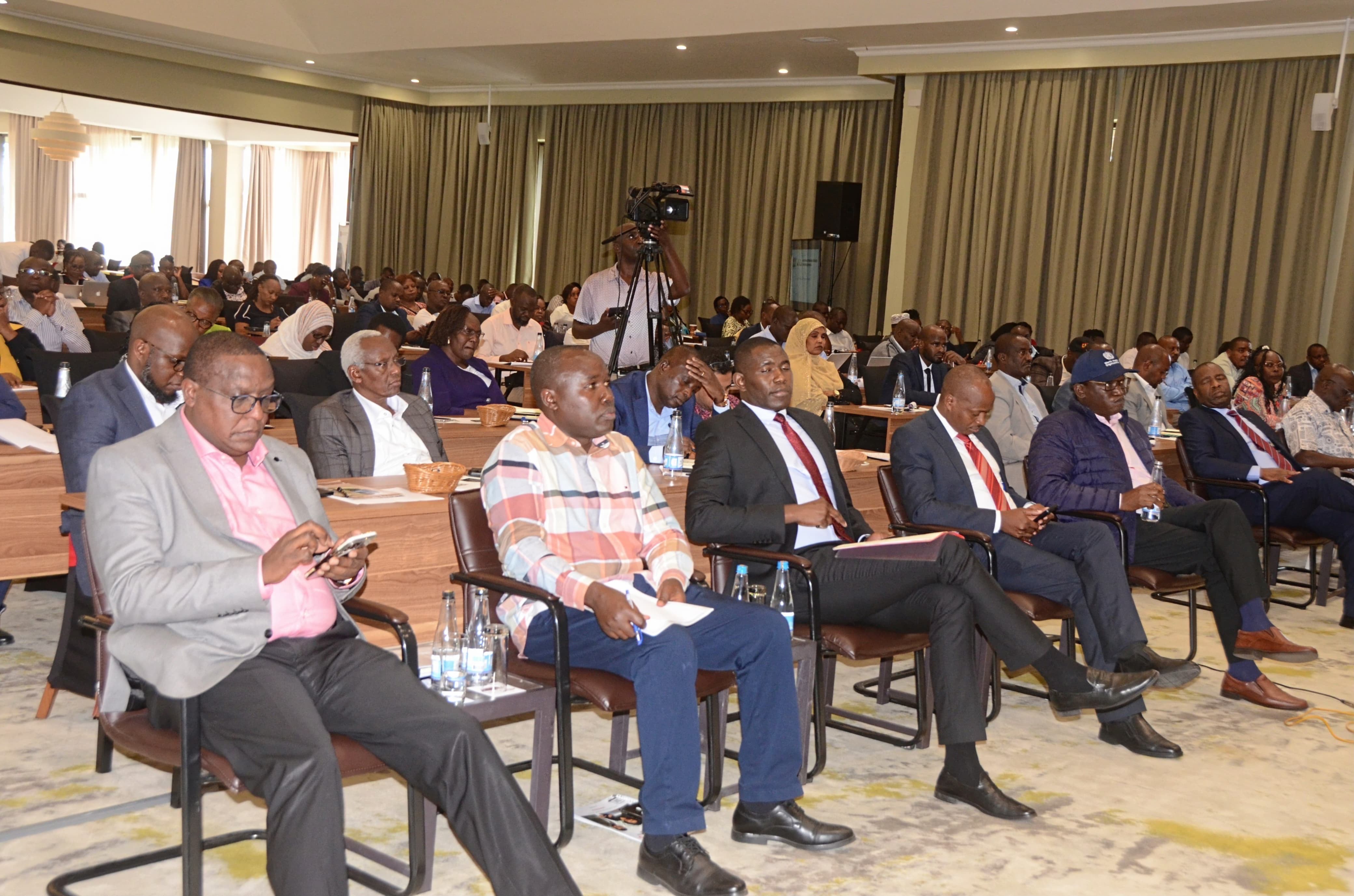 Dr. Ouma Oluga, Principal Secretary for Medical Services, addresses participants during the opening of the Joint Annual Program Review Workshop on the Syndemic Strategic Framework in Naivasha.
