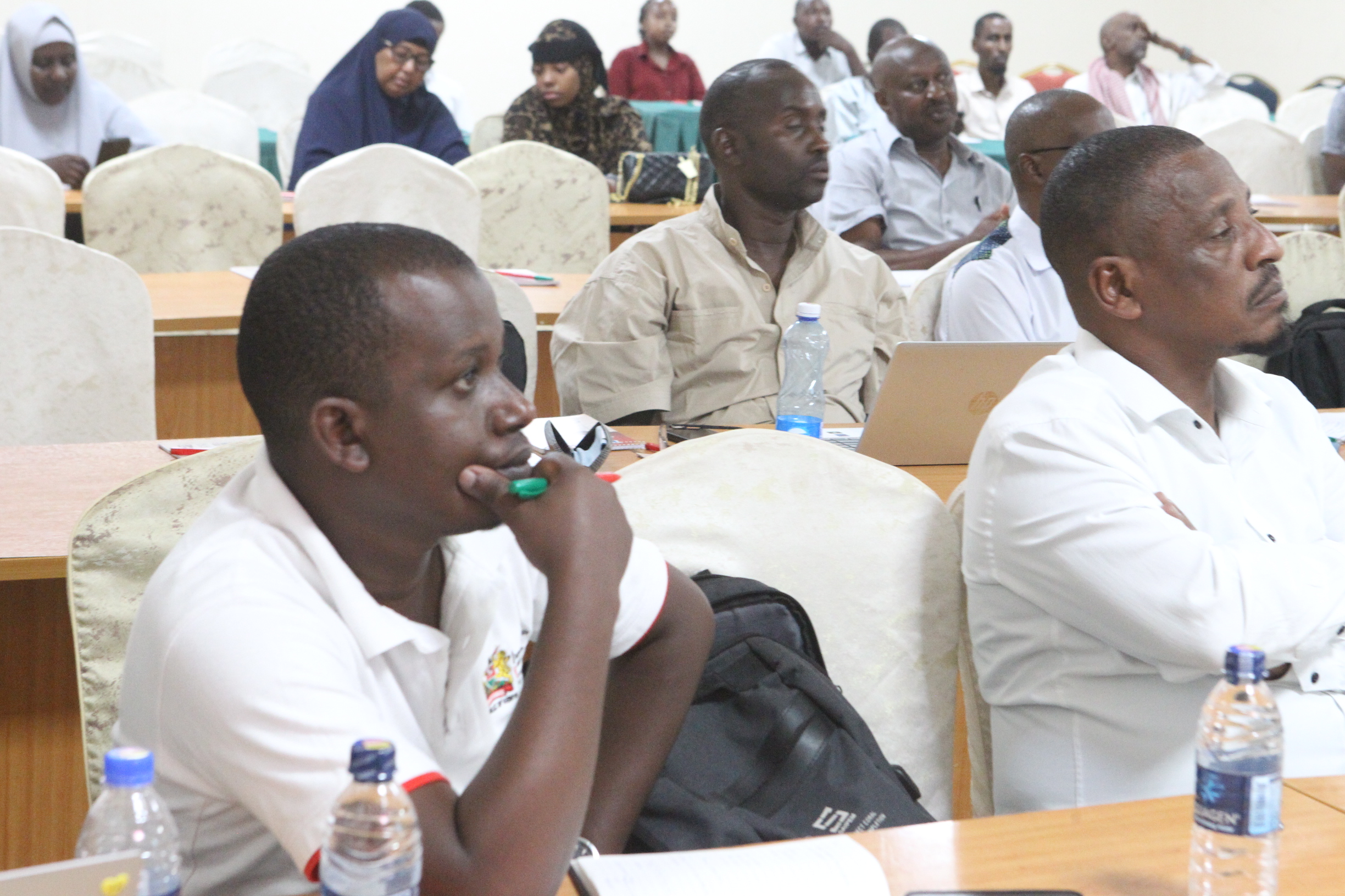Stakeholders follow proceedings during  a public participation forum.