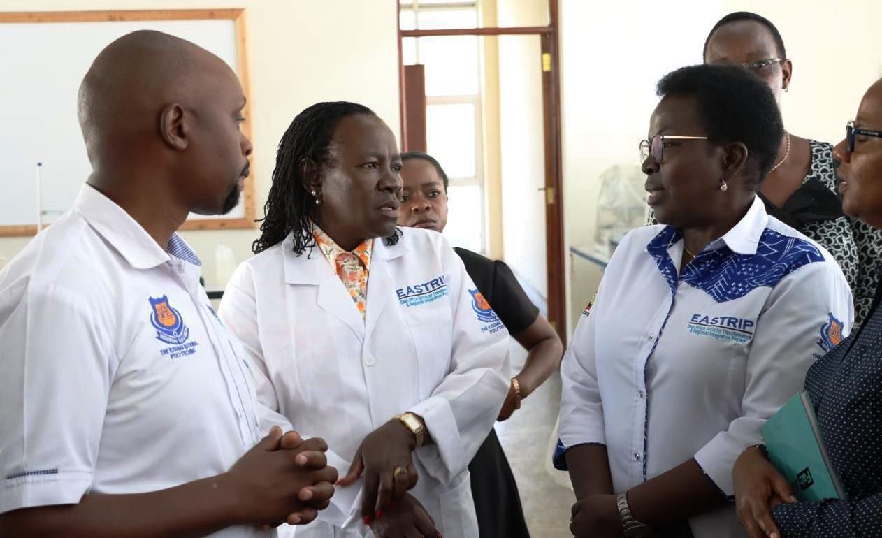 State Department for Technical Vocational Education and Training (TVET) Principal Secretary (PS) Dr. Esther Thaara Muoria (centre) having a word with some of the team members when she led the East Africa Skills for Transformation and Regional Integration Project (EASTRIP) on an inspection tour of the Sh1.2 billion textile technology factory, which has been under construction at the Kisumu National Polytechnic project on Monday.