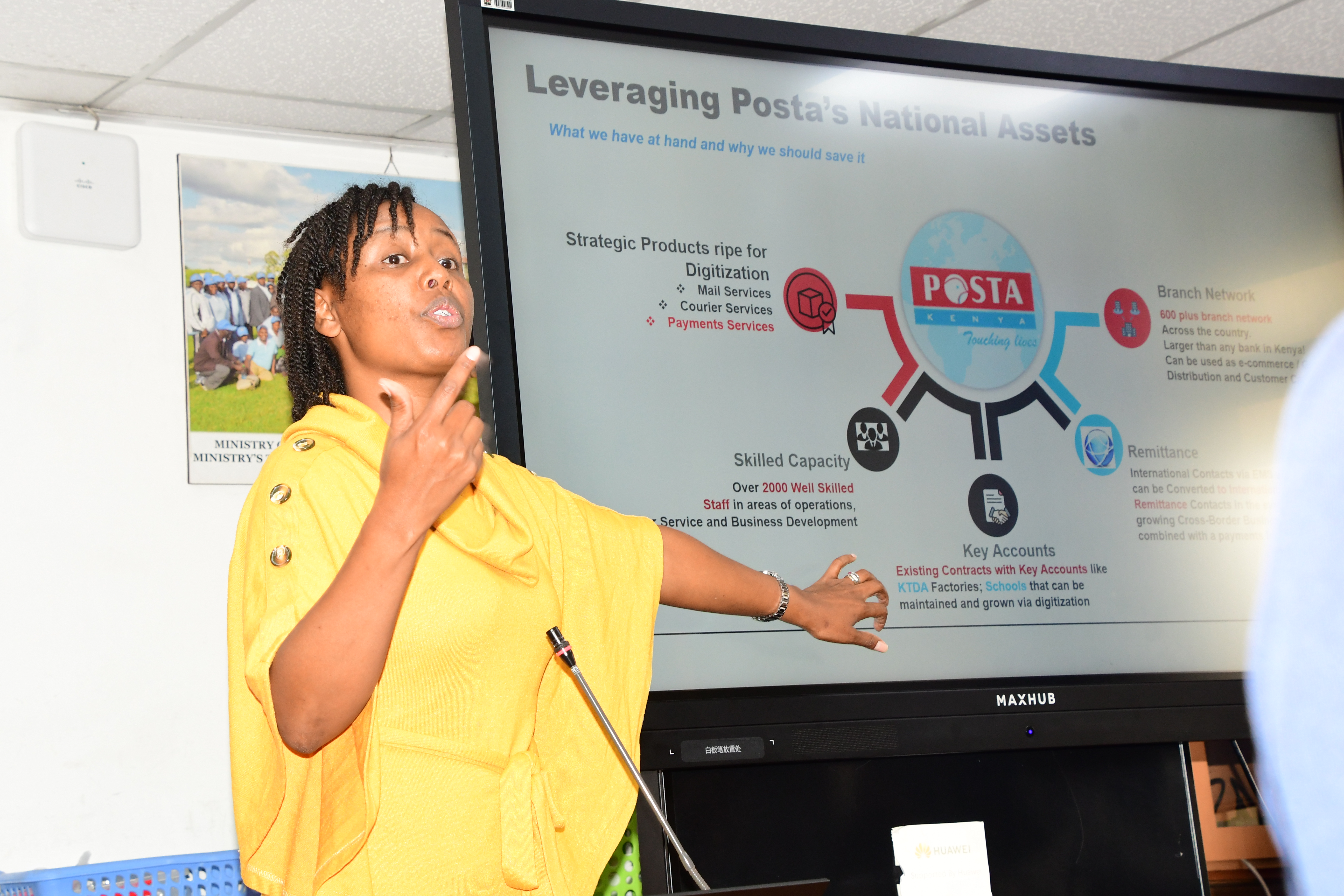Postal Corporation strategic consultant Alice Gathoni, taking the participants through a presentation on the Postapay app at Teleposta Towers on during the sensitization and demonstration meeting. Photo/ Norah Bochere