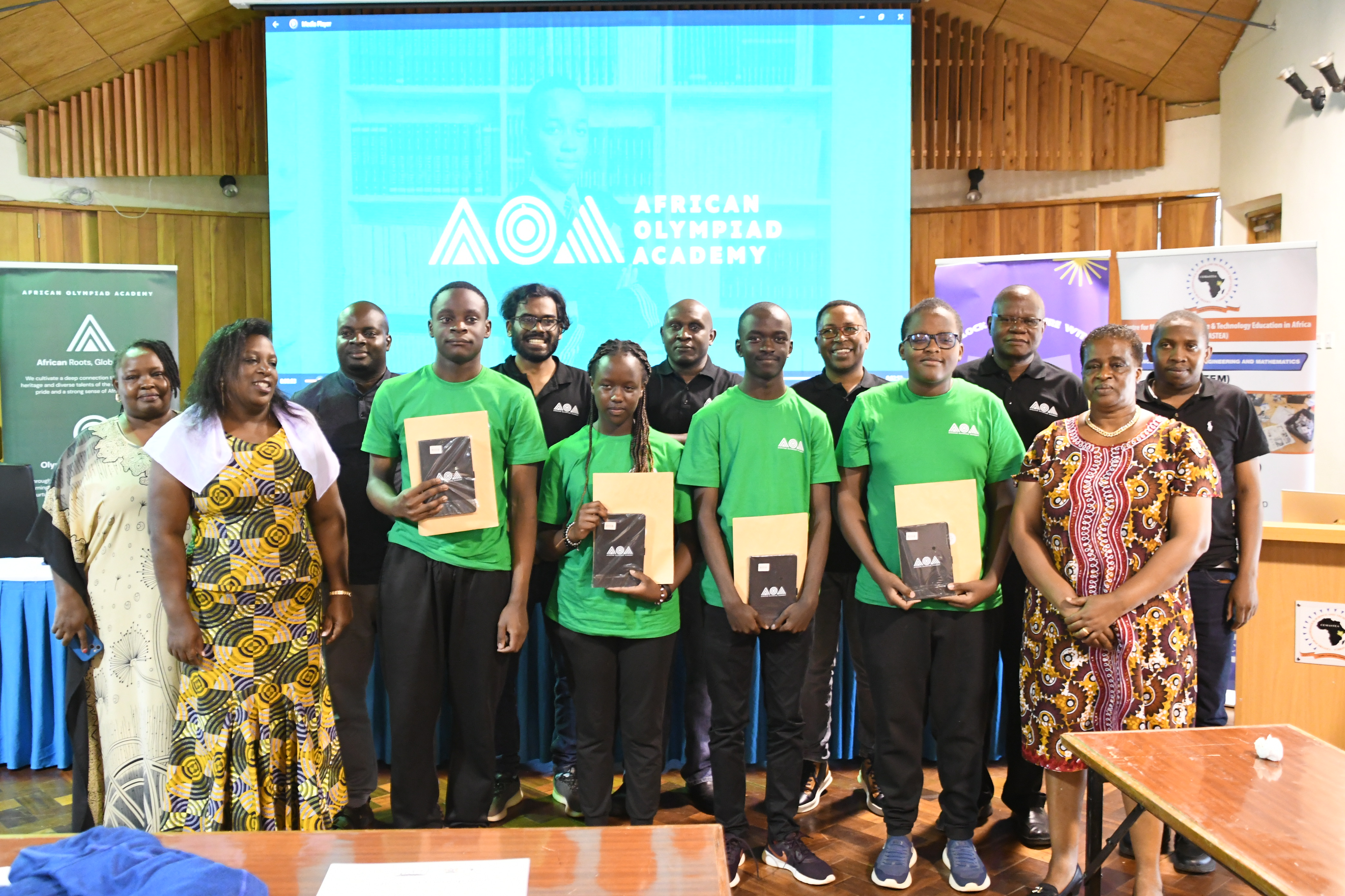 Center for Mathematics, Science and Technology Education in Africa staff at the institution pose for a photograph with four math learners who have successfully won an education scholarship to Kigali, Rwanda. Photos/Bonface Malinda/KNA