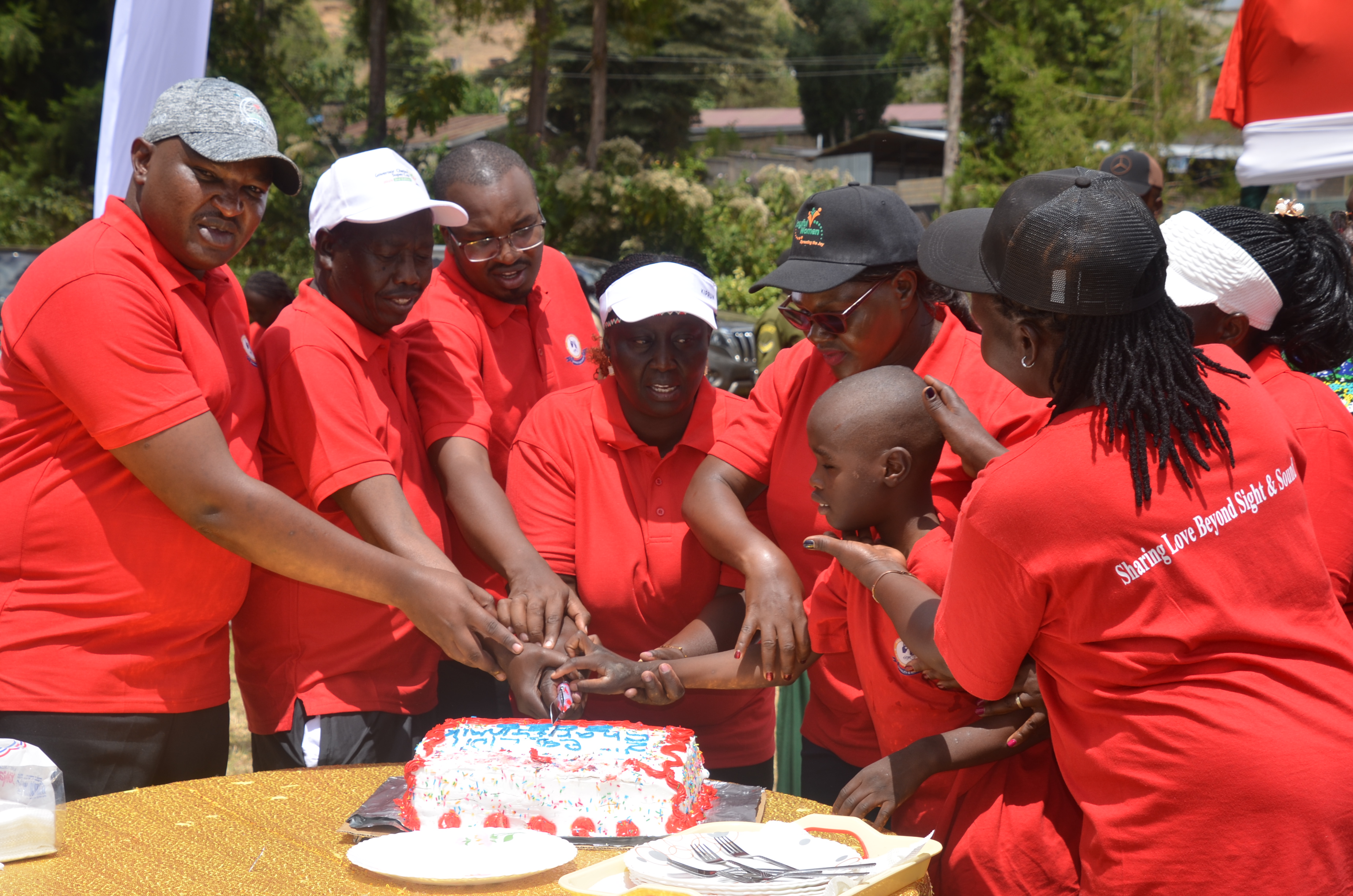 Cabinet Secretary (CS) for Gender, Culture and Children Services, Hanna Cheptumo, joins Baringo leaders in a cake cutting ceremony at Kabarnet School for deafblind 