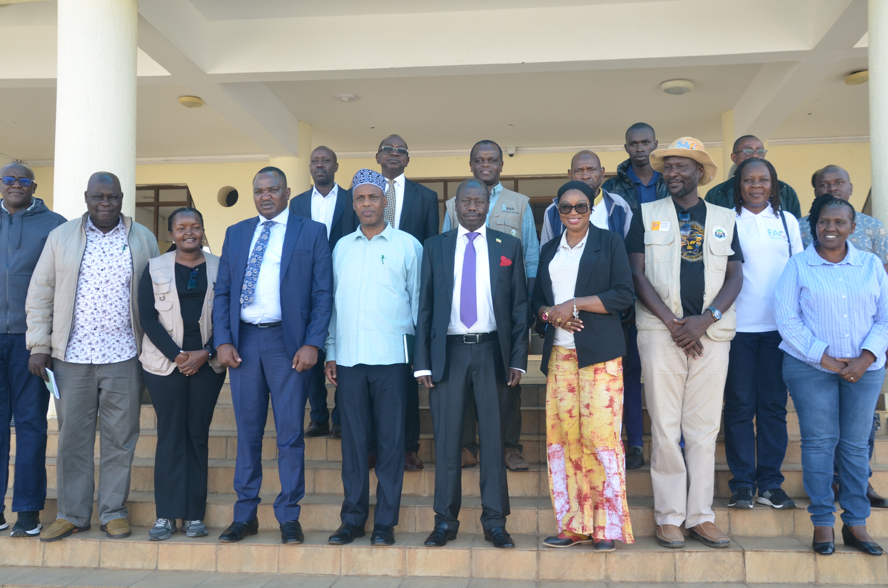 Baringo governor Benjamin Cheboi and International Fund for Agricultural Development (IFAD) Country director Mariatu Kamara joins other officials from Kenya Livestock Commercialization Project (KeLCop) for a photo session outside at the governor’s office in Kabarnet town 