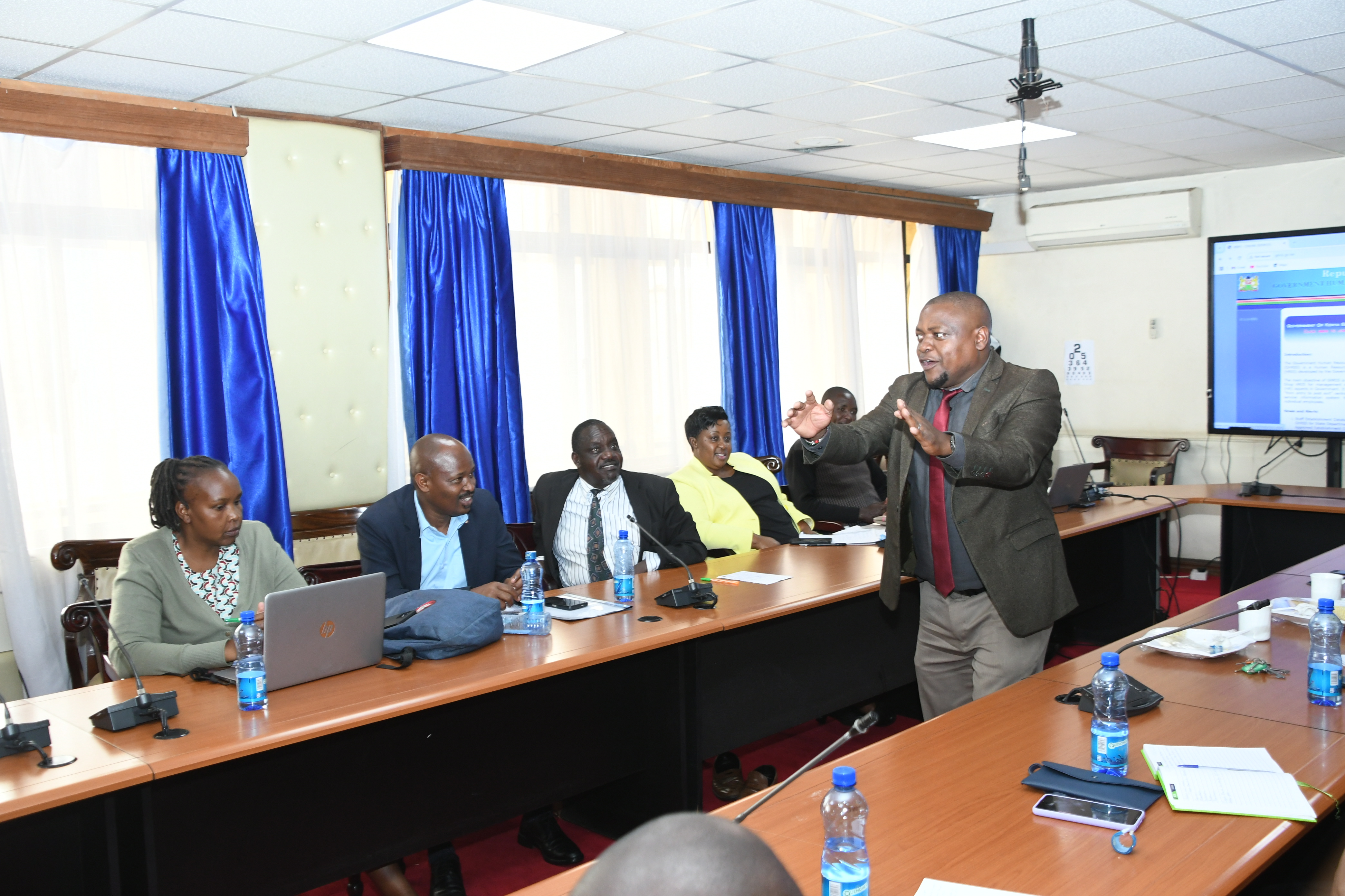 Assistant Director, Human Resource Information System (HRIS), at the Directorate of Human Resource Management at State Department of Public Service Dickson Kinyua speaks at Teleposta Towers, during a one-day training of Heads of Departments on performance Contracting for state Department for Broadcasting where over 40 members of staff attended the training.