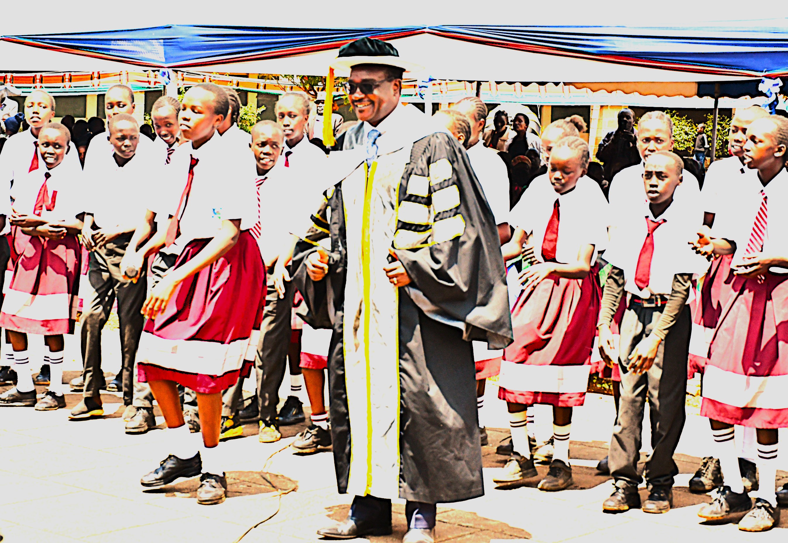 Education Cabinet Secretary Dr. Julius Migos Ogamba joins the students of Seretunin Junior Secondary School for a dance during the 29th Graduation ceremony of Moi Teachers Training College Baringo 