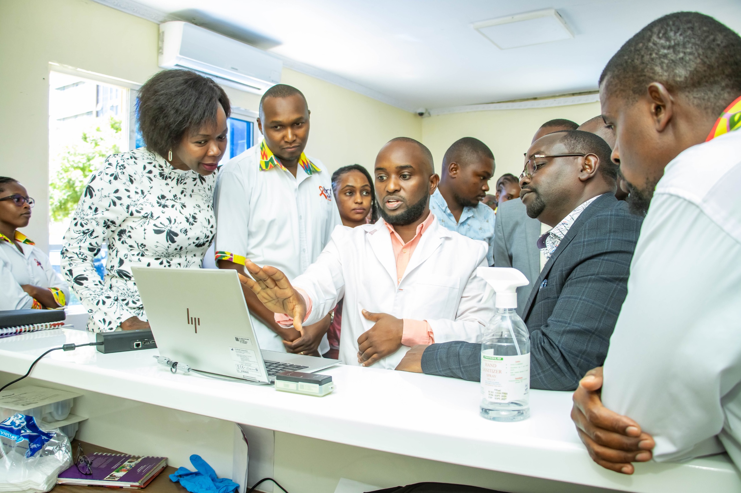 Kirinyaga CECM for Medical Services, Public Health, and Sanitation George Karoki (with glasses) taken through how new technology works by medical staff.