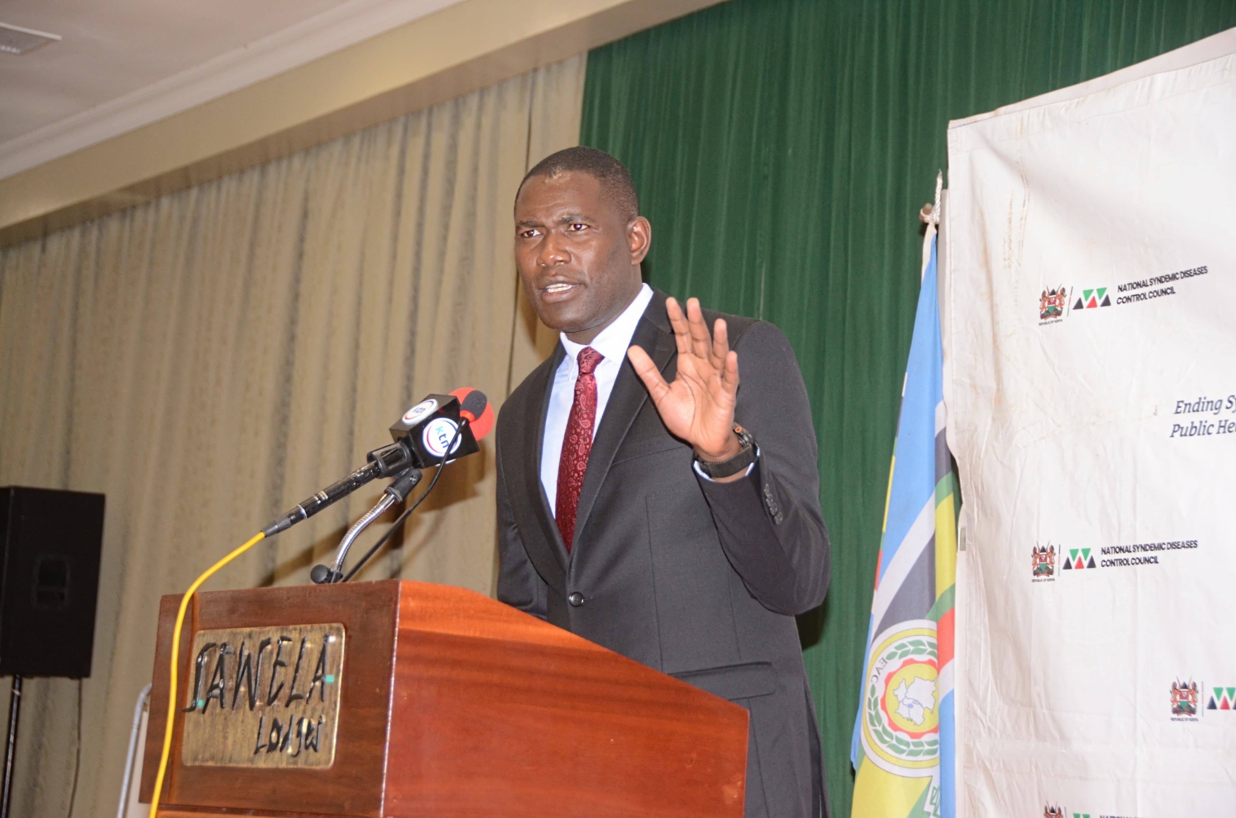 Dr. Ouma Oluga, Principal Secretary for Medical Services, addresses participants during the opening of the Joint Annual Program Review Workshop on the Syndemic Strategic Framework in Naivasha.