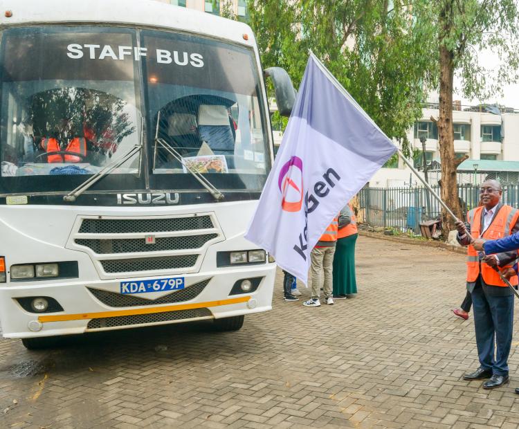 KenGen Managing Director and Chief Executive Officer, Eng. Peter Njenga (right)  f  lags off a vehicle carrying investors for a tour.