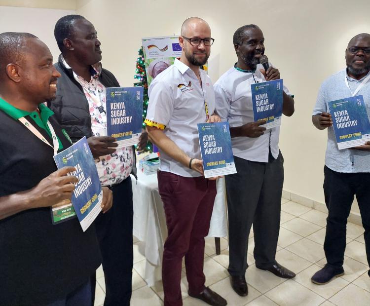 GIZ Project coordinator David Kersting (left) and Kenya Sugar Board Chairman Nicholas Gumbo (right) during the launch of the Kenya Sugar Industry Grower's Guide in Kisumu. Photo/Photo Chris Mahandara