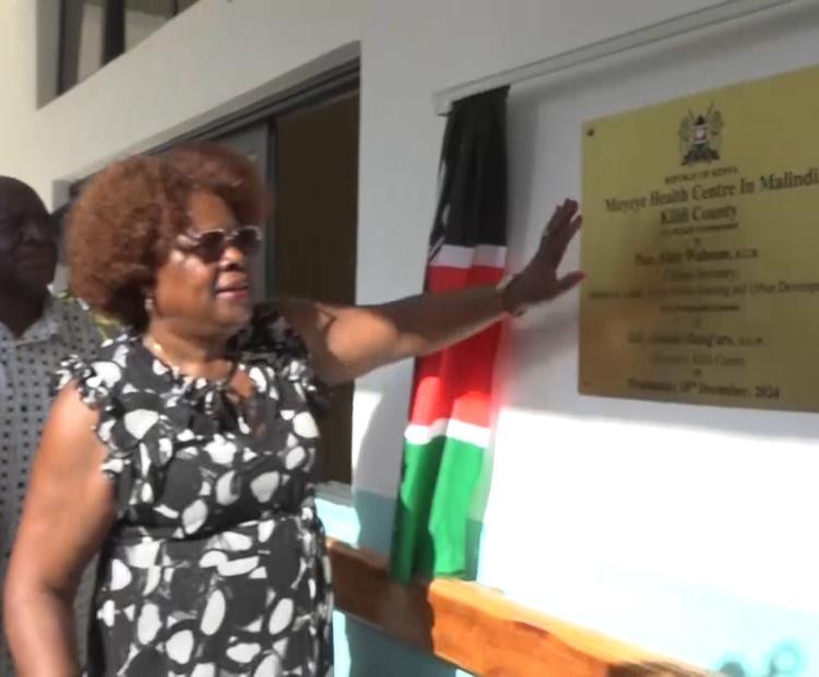 Lands CS Alice Wahome unveils the plaque to signify the official opening of the Muyeye Health Centre Maternity wing in Malindi town, Kilifi County. Photo/Emmanuel Masha