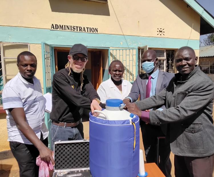 National Council of Persons With Disability lead team in Trans Nzoia County led by Senior Program Officer Wilson Kabiro (Left) and Stephen Wafula (Second Left), hand over cryogenic equipment to the management of Kitale Sub County Hospital Chief Administrative Officer Joanes Nyongesa (Right).