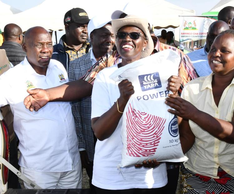 Women in Baringo rejoice after receiving kitchen garden  fertilizer distributed by PS for Agriculture Dr. Paul Ronoh  at Koibatek Agricultural Training Centre in Eldama Ravine: PHOTO/ VINCENT MININGWO
