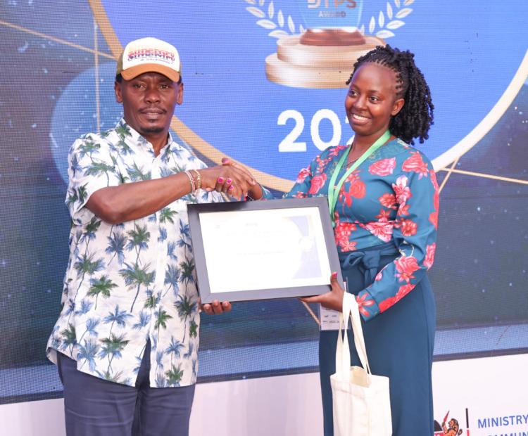 The CS for the Ministry of Information,  Communications and the Digital Economy, Hon.  William Kabogo Gitau (left) awarding a winner  during the awarding ceremony of The Digital  Transformation Public Sector Forum and Awards  (DTPS) 2025. Photo/ Beverlyne Musili
