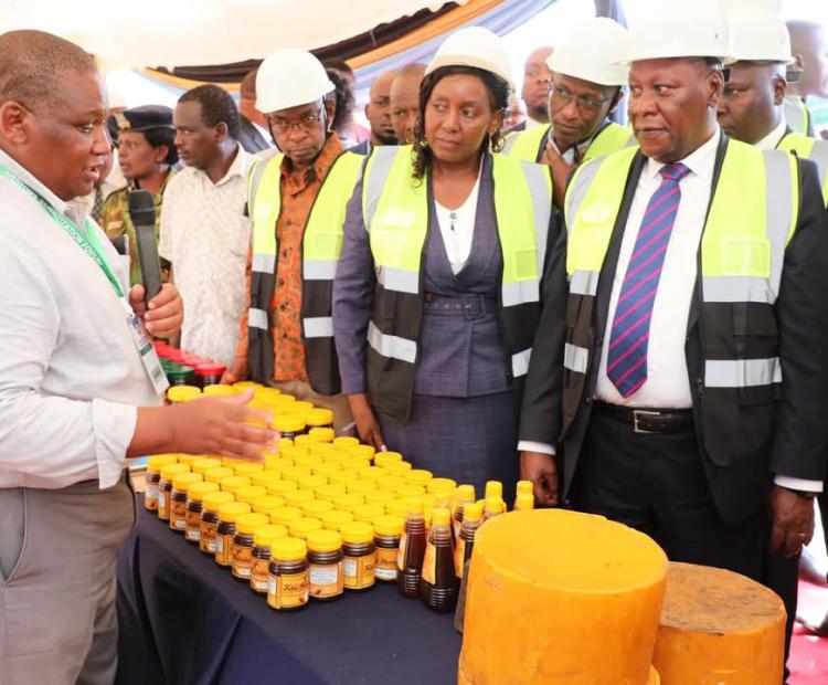 Kitui Governor, Dr Julius Malombe, sampling-out some of the industrial products showcased during the two-day Kitui County Investors Sensitization Forum