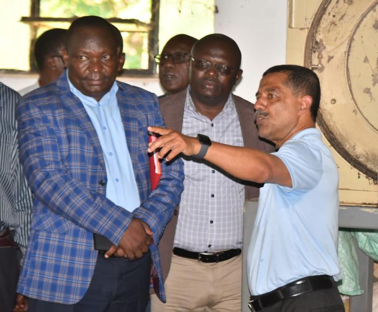 State Department for Cooperatives Secretary Administration Amos Mariba (in checked blue  court) during the Luanda Ginnery site handing over ceremony to the contractor. PHOTOS BY CHRIS MAHANDARA