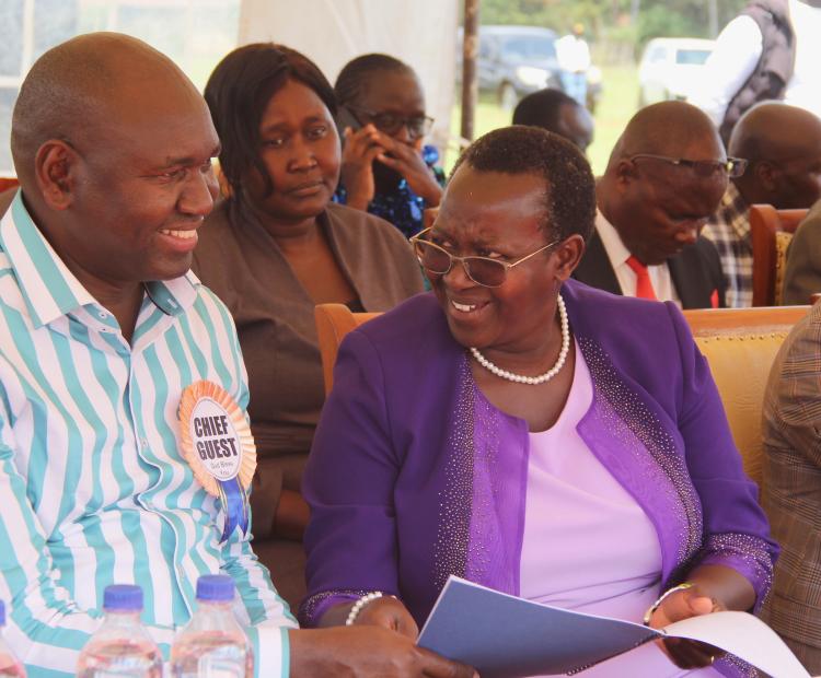 Basic education PS Amb. Prof. Julius Bitok (L) in consultation with Turbo MP Janet Sitienei.