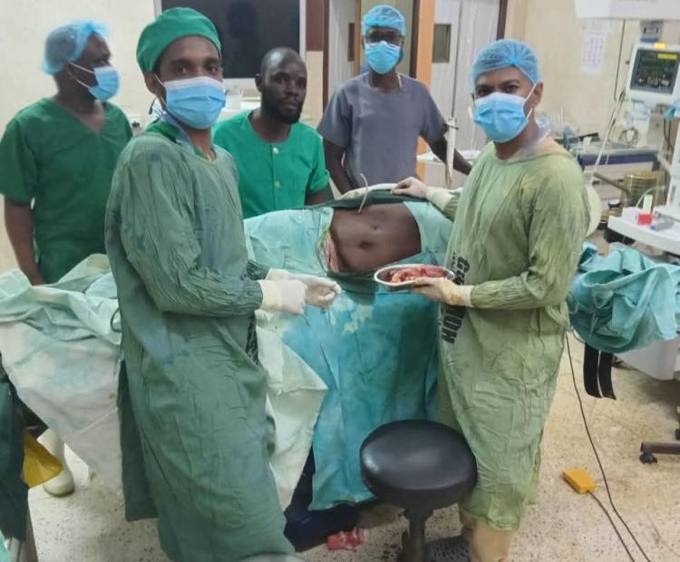 Doctors and other medical team conducting a surgery on a 65-yearold patient diagnosed with renal cell carcinoma (cancer of the right kidney) at King Fahd Hospital in Lamu County