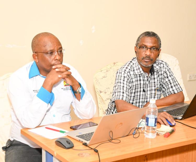 KMD deputy director Kennedy Thiong’o (left) follows the proceedings during the workshop. 