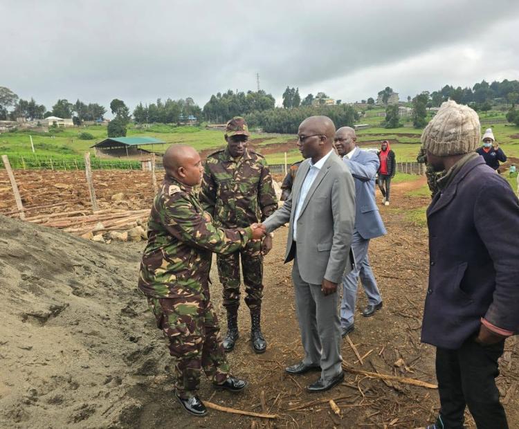 Nakuru Deputy Governor David Kones (Right) welcomes Major DG Roba of Kenya Defense Forces) who led military engineers, quantity surveyors and architects on site assessments of the stalled Olenguruone Stadium project prior to formally taking completion of the facility.
