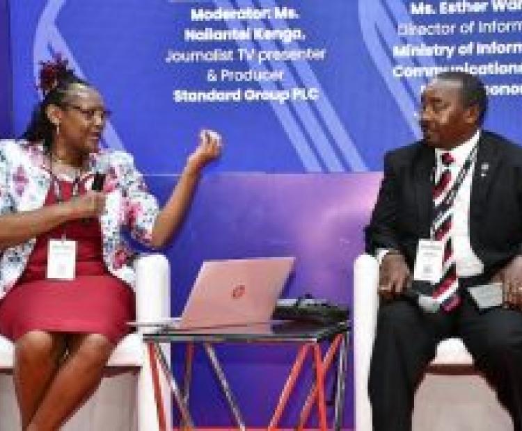 Ms. Esther Wanjau, Director of Information (ICT) at the Directorate of Information (L) , engages with James Mureu, the Chairman of the Micro and Small Enterprises Authority (R), on the implementation of Artificial Intelligence (AI) in business transactions in Kenya.