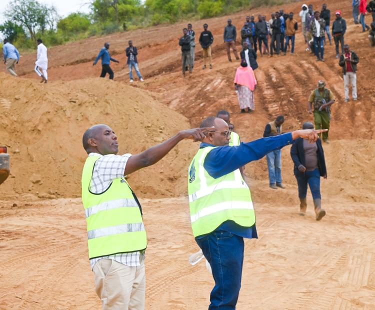 State Department for ASALs and Regional Development Kello Harsama (centre) inspects the ongoing construction of Somare Dam in Moyale, Marsabit County.