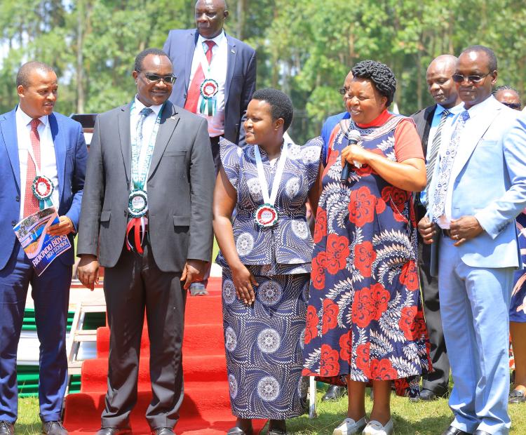 Education Ministry CS Ogamba Migosi (second Left) with scholars and educationist at Riokindo Boys High school in Bokimonge ward, Bomachoge Borabu Constituency in Kisii County