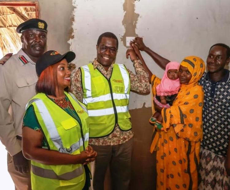 Energy and Petroleum Cabinet Secretary Opiyo Wandayi lights up electricity in a house in Gubani village Garsen constituency of Tana River.