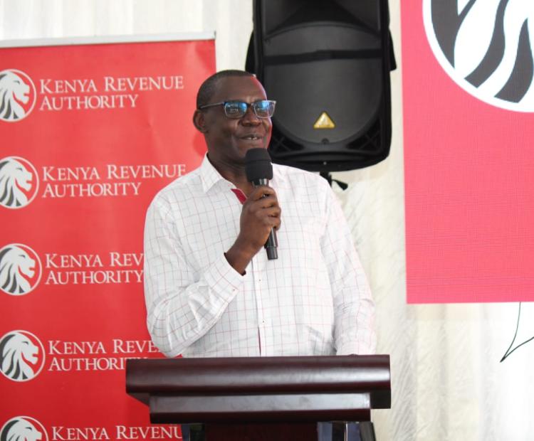 Kenya Revenue Authority (KRA) Commissioner for Micro and Small Taxpayers George Obell speaking to taxpayers from Kisii and Homabay counties during a taxpayers engagement forum.